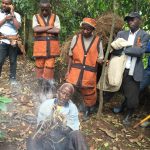 Batwa demonstrating making fire using forest trees on the Batwa Forest Experience_Easy-Resize.com