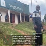 Our field officer posing outside the offices of Nyanamo Community Conservation Development Organization (NCCDO) whom we collaborate with in this Bwindi conservation mission